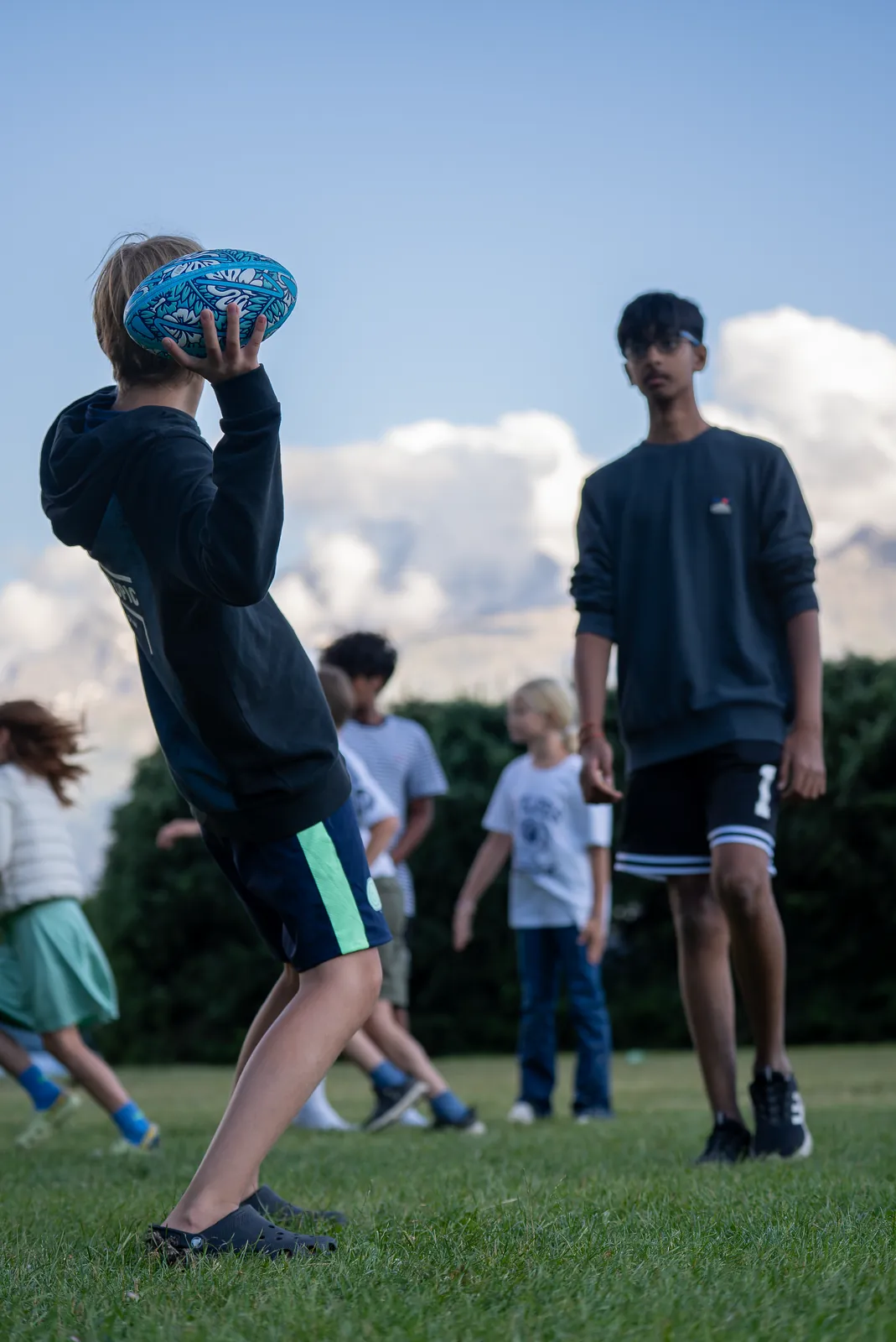 A camper catching a ball, filmed from the side